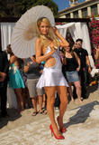 Paris Hilton in skimpy outfit show of her body as she poses as she launch The Bandit, the first interchangeable hair extension headband in Malibu,
