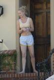 Katherine Heigl in shorts and sports bra
