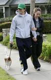 Jennifer Love Hewitt and fiance taking a walk with their dog